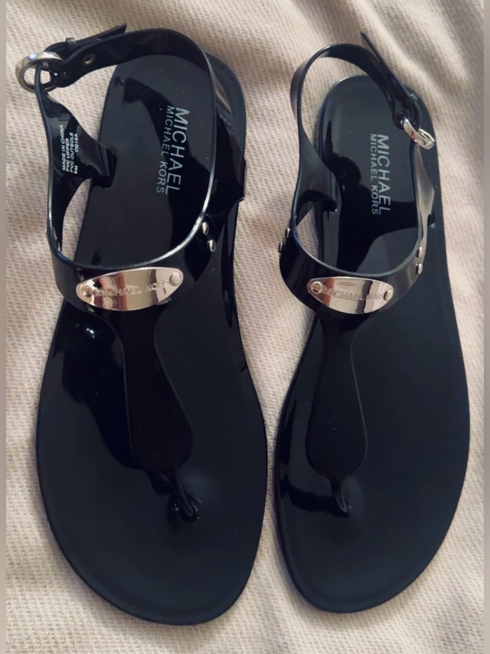 Michael Kors Black Patent T-Strap Jelly Sandals with Silver Logo Plate